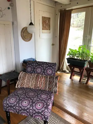 a living room with a couch and a table at Charm at the foot of the Berkshires in Hillsdale