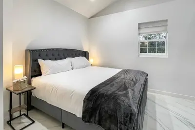 a bedroom with a bed and a window at Cozy Cottage in Cos Cob in Greenwich