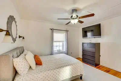 a bedroom with a bed and a ceiling fan at Hudson Valley Retreat with Pool Near Greenwood Lake in Monroe