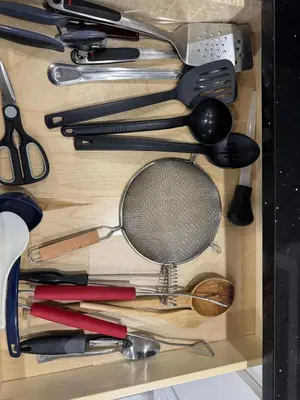 a drawer filled with lots of cooking utensils at 2-Bedroom Sleeps 6 Stay Near EWR & American Dream in Newark