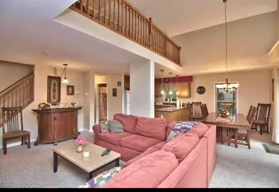 a living room with a couch and a table at Chalet in Masthope Community in Lackawaxen