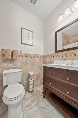 a bathroom with a toilet and a sink and a mirror at HUGE Cozy Jersey City Oasis with Double Balcony - 20 mins to NYC in Jersey City