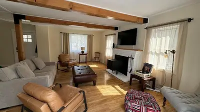 a living room with a couch and a fireplace at Stay Near Ski Berkshires, Mid-Week & Promo Deals! in New Lebanon