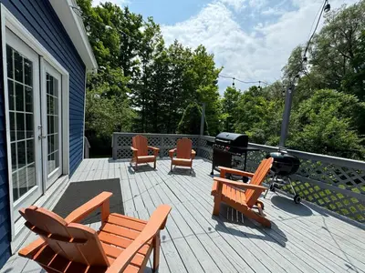 a deck with chairs and a grill on a house at Stay Near Ski Berkshires, Mid-Week & Promo Deals! in New Lebanon