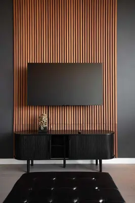 a flat screen tv on a wall in a room at Exclusive 1BR Apt with NYC View in Hoboken