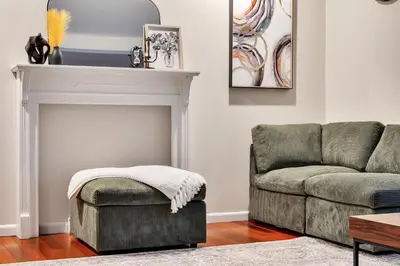 a living room with a couch and a chair at Vacation Home in Albany in Albany