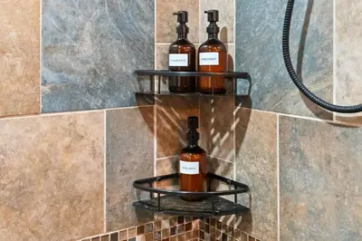 three bottles of wine on a shelf in a bathroom at Ski In Ski Out Hunter Mtn Seasonal Pool Access w Panoramic Views Hike Swim Fish Unwind in Lanesville