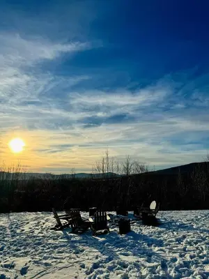 a group of chairs sitting in the snow at Cozy Lux Mountain Lodge Hot Tub Mtn Views Skiing in Jewett