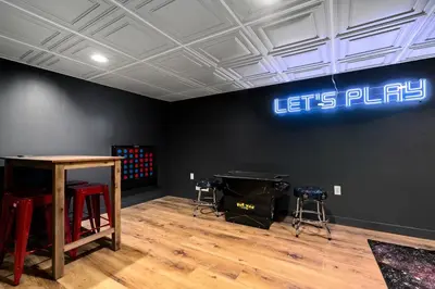 a room with a ping pong table and stools at Vermont Retreat with private pool and tennis court in Wilmington