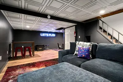 a living room with a couch and a stage at Vermont Retreat with private pool and tennis court in Wilmington