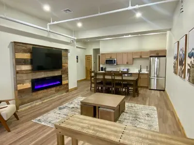 a living room with a kitchen and a dining room at Luxury Townhome 107 in Wilmington