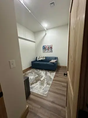 a living room with a blue couch in a room at Luxury Townhome 107 in Wilmington