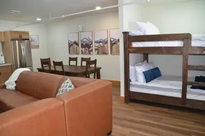 a living room with a couch and bunk beds at Luxury 1 Bedroom Lodge Unit 301 in Wilmington