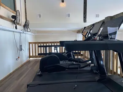 a gym with tread machines in a room at Luxury 1 Bedroom Lodge Unit 301 in Wilmington
