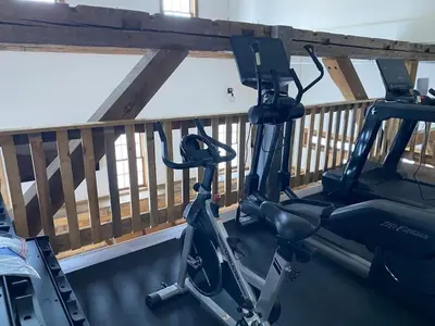 a gym with two exercise bikes on a balcony at Luxury 1 Bedroom Lodge Unit 301 in Wilmington