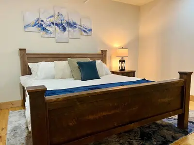 a bedroom with a large bed in a room at Luxury Townhome 105 in Wilmington