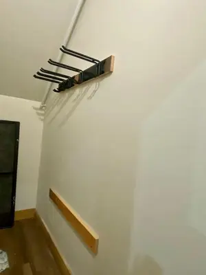 a white wall with a shelf on the wall at Luxury TownHome 106 in Wilmington
