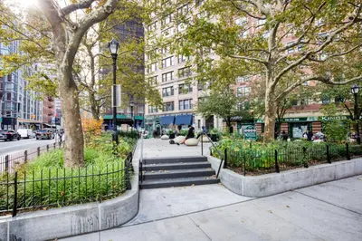 a sidewalk with stairs and trees in a city at Tribeca Studio w City views Gym Pool NYC-110 in New York