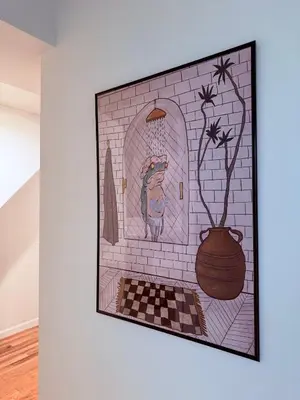 a painting of a cat in a brick wall at le plateau suite in Queens