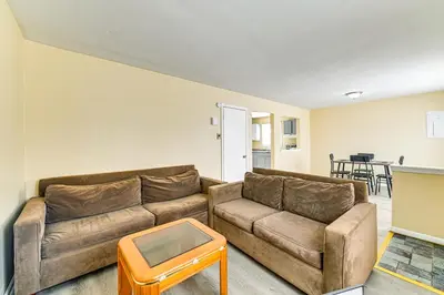 a living room with a couch and a table at Near Hospitals Home with Yard in Albany! in Albany