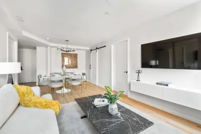 a living room with a couch and a table at 3BR Penthouse with Massive Private Rooftop in New York