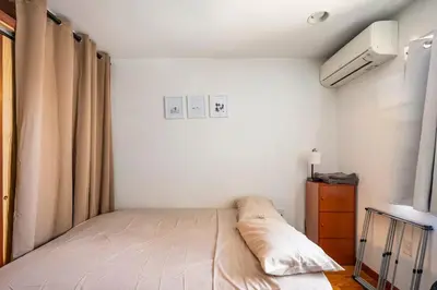 a small bedroom with a bed and a dresser at BEST LOCATION IN QUEENS, Everything is near by, PRIVATE ROOM, LaGuardia Airport 10min in Queens