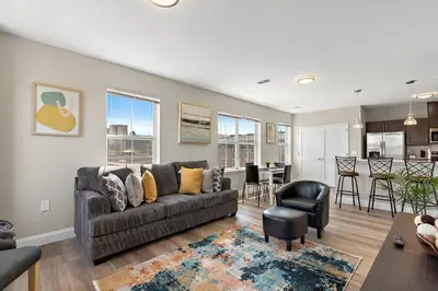 a living room with a couch and a table at City Views 1BR Free-Parking- Easy NYC Access in Newark