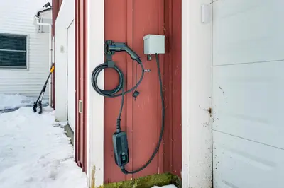 a hose is hooked up to a red door at Ski, Golf and Hike Spacious Dover Retreat! in Dover