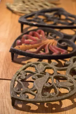 a group of metal objects on a wooden table at 1894 Catskills Farmhouse Retreat in Tannersville