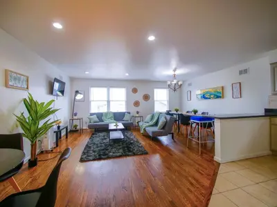a living room with a couch and a table at Impressive 3bed 2bath apt close to NYC in Jersey City