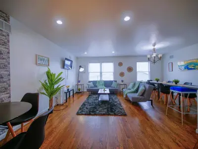 a living room with a couch and a table at Impressive 3bed 2bath apt close to NYC in Jersey City