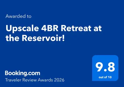 a blue screen with the text upgraded to upgrade retreat at the reservoir at Upscale 4BR Retreat at the Reservoir! in Bridgeport
