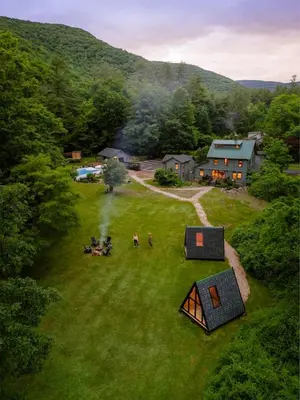 an aerial view of a group of people in a field at The Bend Micro Resort in Phoenicia