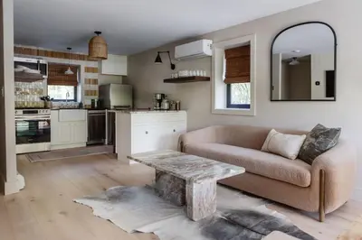 a living room with a couch and a table at The Bend Micro Resort in Phoenicia