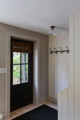 a room with a black door and a window at The Bend Micro Resort in Phoenicia