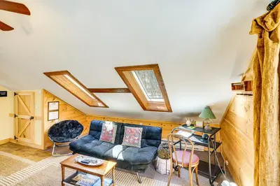 a living room with a couch and a table at 3 Mi to Hiking Cozy Mt Tremper Apt in Mount Pleasant