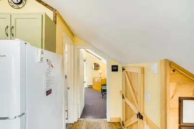 a hallway with a white refrigerator and a room at 3 Mi to Hiking Cozy Mt Tremper Apt in Mount Pleasant
