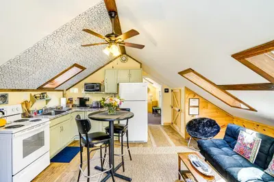 a kitchen and living room with a couch and a table at 3 Mi to Hiking Cozy Mt Tremper Apt in Mount Pleasant