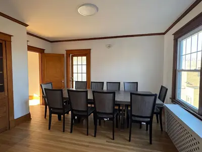 a dining room with a table and chairs at Warm and Cozy 4Bd 2Bath in Southington