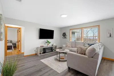 a living room with a couch and a tv at 40 Spacious Sleek Cozy in Middletown