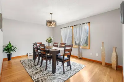 a dining room with a table and chairs at 40 Spacious Sleek Cozy in Middletown