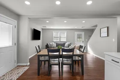 a kitchen and dining room with a table and chairs at 22- 4 Br 2 Ba House - Central CT in New Britain