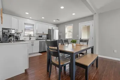 a kitchen with a dining room table and chairs at 22- 4 Br 2 Ba House - Central CT in New Britain