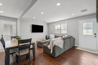 a living room with a couch and a table at 22- 4 Br 2 Ba House - Central CT in New Britain