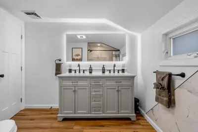 a bathroom with a sink and a mirror at 27- Luxury Collection in Southington