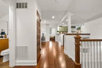 a kitchen and living room with white walls and wood floors at 31 - Downtown Terryville- 1 Br in Plymouth