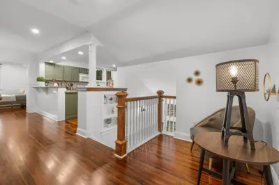 a kitchen and living room with a table and a lamp at 31 - Downtown Terryville- 1 Br in Plymouth