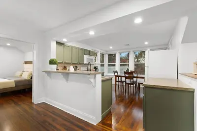a kitchen and living room with a couch and a table at 31 - Downtown Terryville- 1 Br in Plymouth