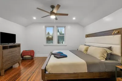 a bedroom with a bed and a ceiling fan at 31 - Downtown Terryville- 1 Br in Plymouth