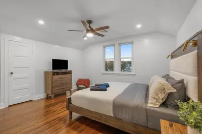 a bedroom with a bed and a ceiling fan at 31 - Downtown Terryville- 1 Br in Plymouth